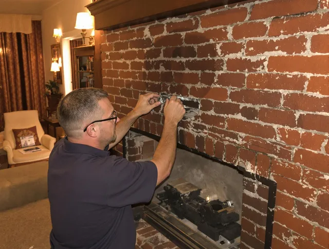 West Whittier-Los Nietos Chimney Sweep expert fixing a fireplace in West Whittier-Los Nietos, CA